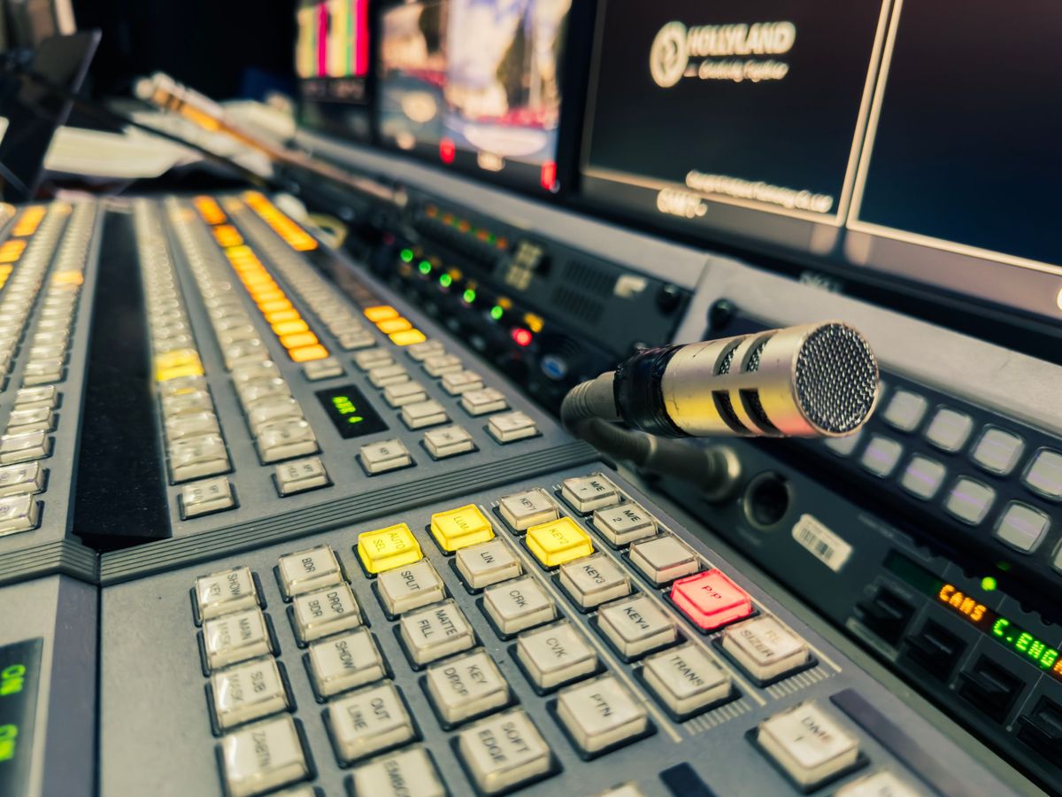 Broadcast vision mixer control panel with a talkback microphone